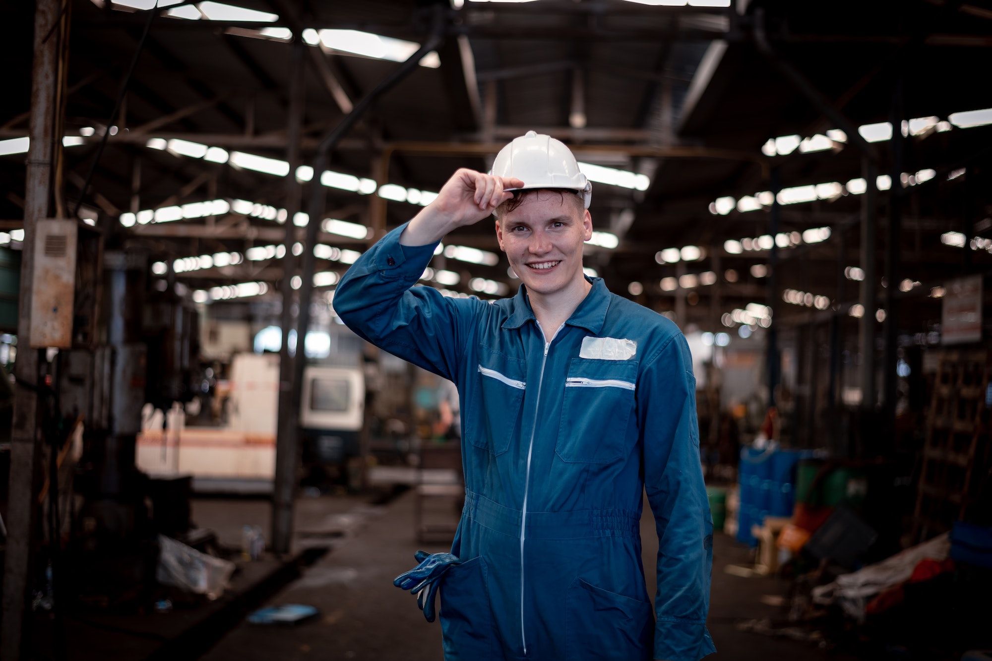 Portrait engineer worker industry wearing safety uniform pose standing at factory workplace with ind